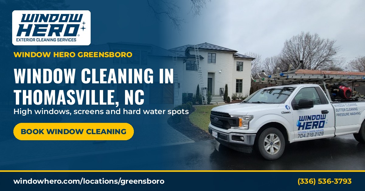 Window Hero service truck parked in front of a two-story home ready for window cleaning